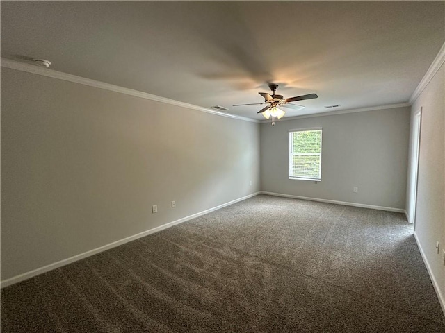 carpeted empty room featuring ornamental molding, baseboards, and a ceiling fan
