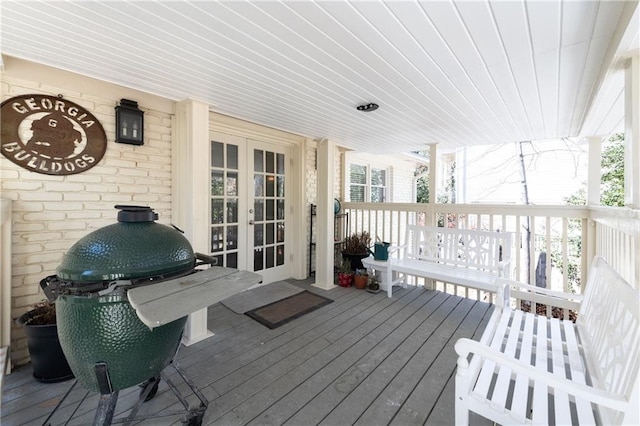 wooden terrace featuring grilling area and french doors