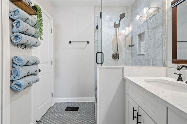 bathroom featuring an enclosed shower and vanity