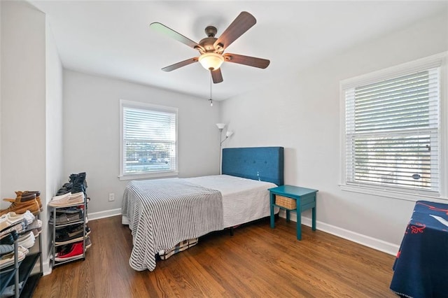 bedroom featuring ceiling fan and dark hardwood / wood-style flooring