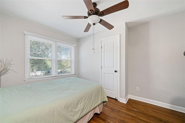 bedroom featuring dark wood-type flooring and ceiling fan