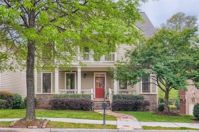 view of front of home featuring a porch and a front lawn