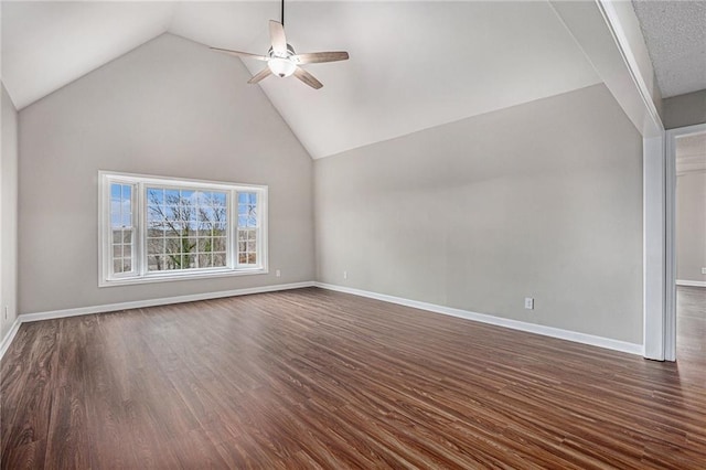 interior space featuring dark wood finished floors, baseboards, lofted ceiling, and ceiling fan