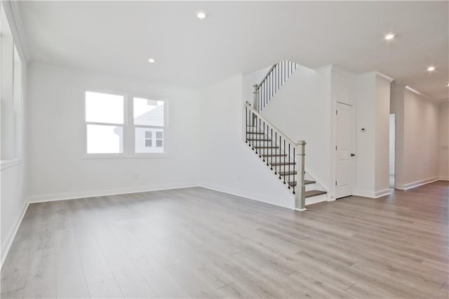 4212 Adler Cir, Buford, GA 30519 - unfurnished living room with crown molding, stairway, recessed lighting, baseboards, and wood finished floors