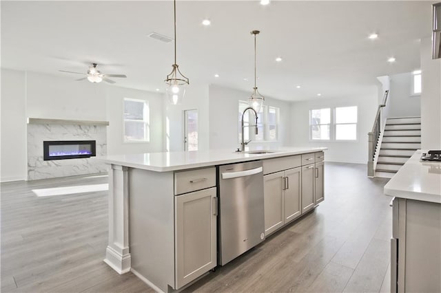 4212 Adler Cir, Buford, GA 30519 - kitchen featuring light countertops, dishwasher, ceiling fan, a sink, and open floor plan