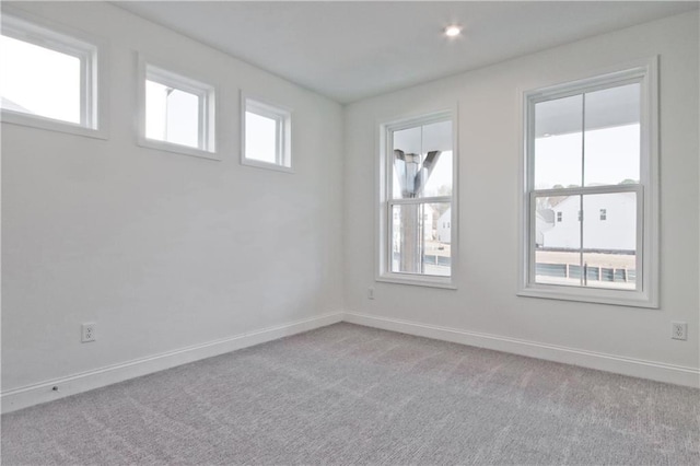 4212 Adler Cir, Buford, GA 30519 - spare room featuring baseboards, light colored carpet, and a wealth of natural light