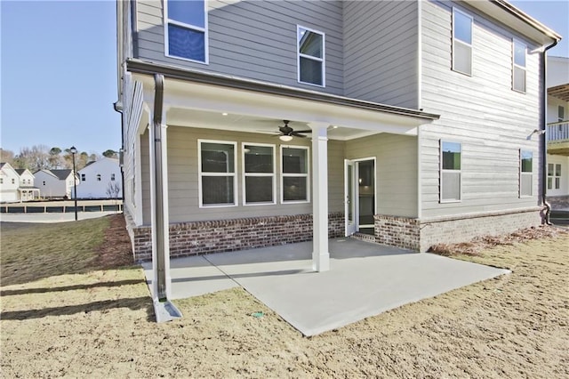 4212 Adler Cir, Buford, GA 30519 - back of property featuring a ceiling fan and a patio