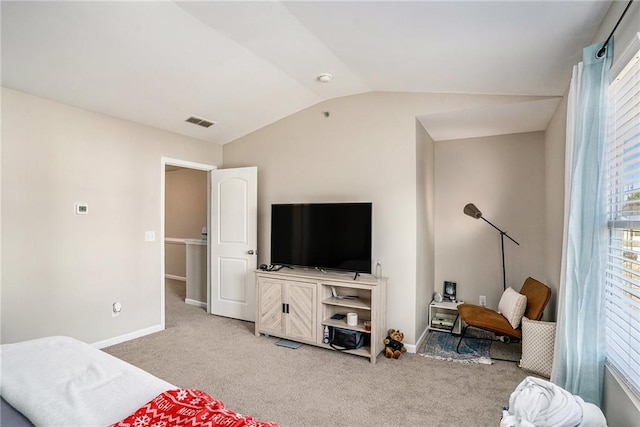 bedroom with light carpet and vaulted ceiling