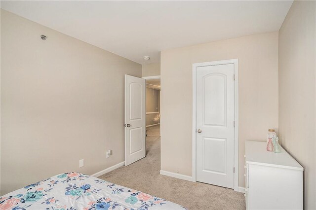 unfurnished bedroom with light colored carpet