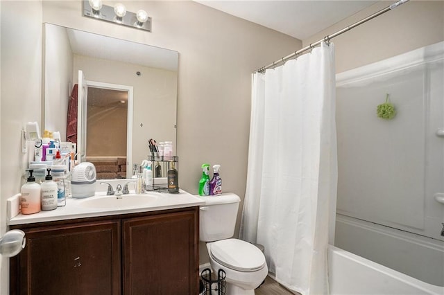 full bathroom featuring vanity, wood-type flooring, shower / tub combo, and toilet