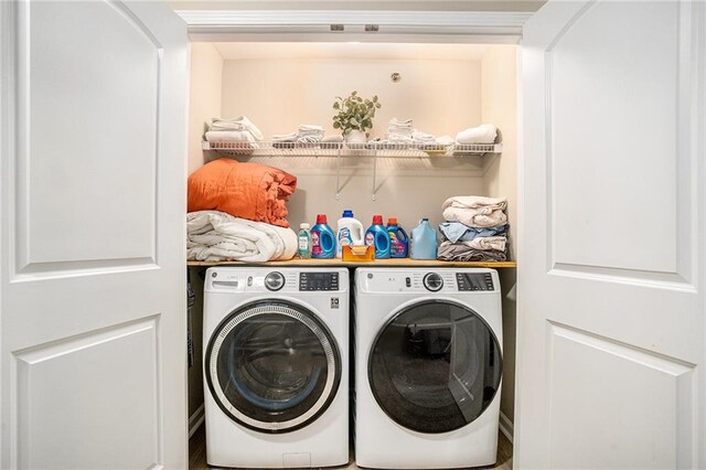 laundry area featuring washing machine and clothes dryer