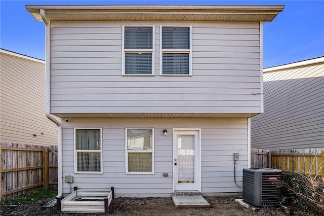 back of property with central AC unit