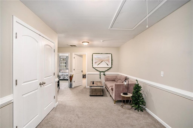 sitting room with light colored carpet