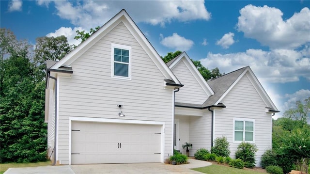 front of property with a garage