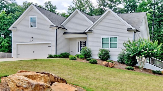 view of front facade featuring a garage and a front lawn