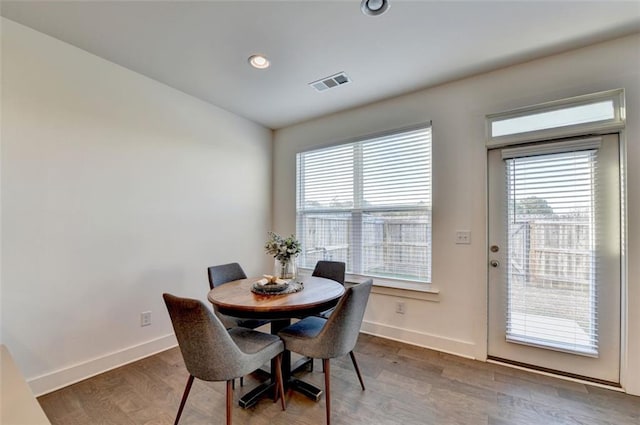 dining area featuring hardwood / wood-style flooring