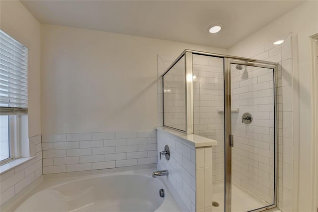 bathroom featuring plus walk in shower