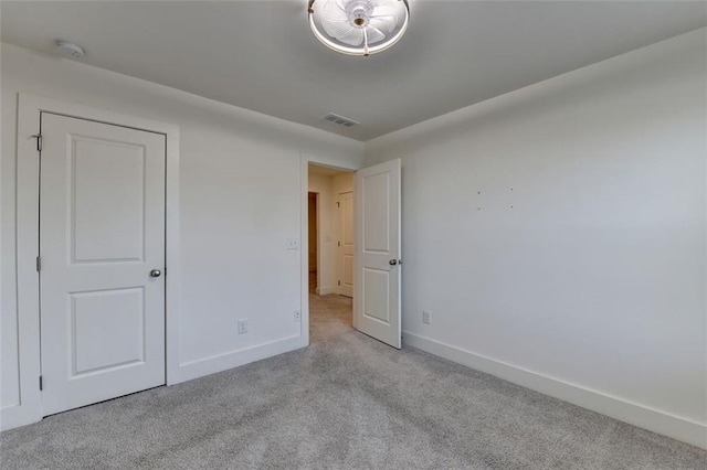 unfurnished bedroom with light carpet