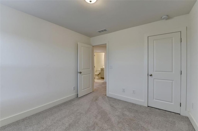 unfurnished bedroom with light carpet