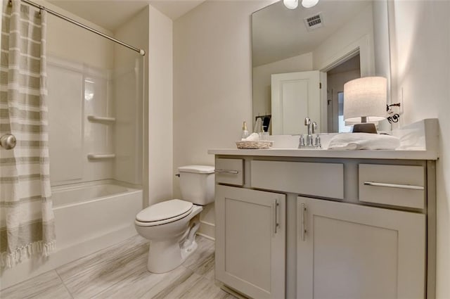 full bathroom featuring shower / bath combo with shower curtain, vanity, and toilet