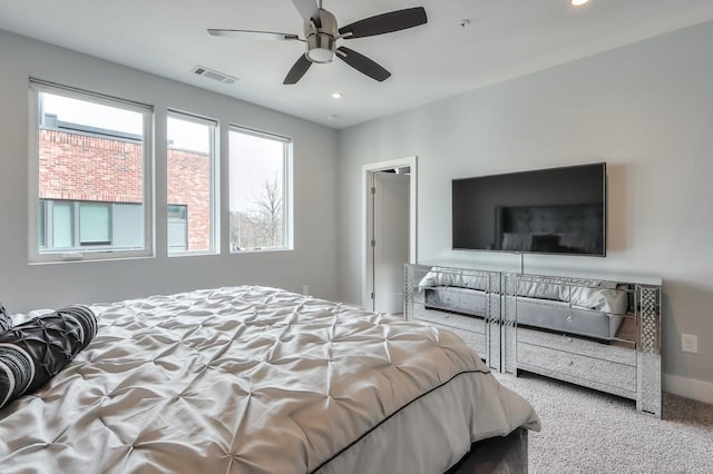 carpeted bedroom featuring ceiling fan, baseboards, visible vents, and recessed lighting