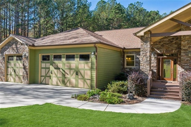 exterior space featuring a front yard and a garage