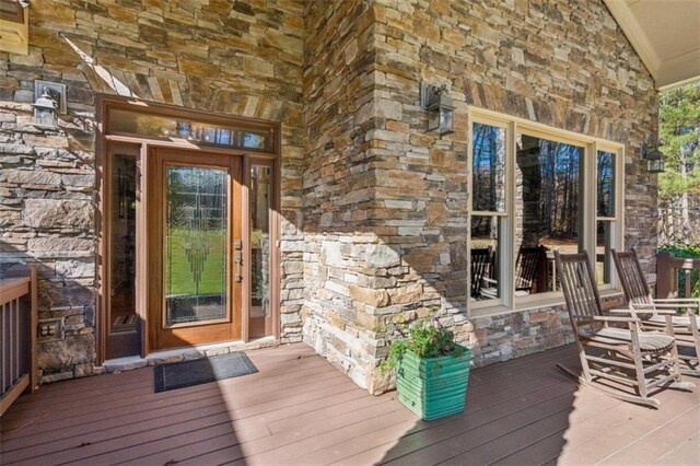 view of exterior entry featuring a porch