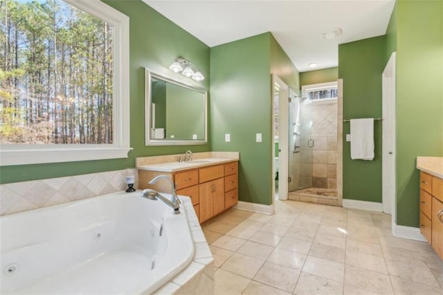 bathroom featuring tile patterned floors, vanity, and independent shower and bath