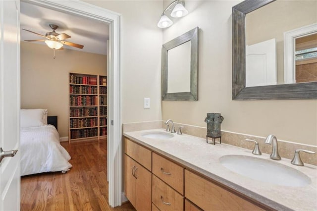 bathroom featuring ceiling fan, vanity, and hardwood / wood-style flooring