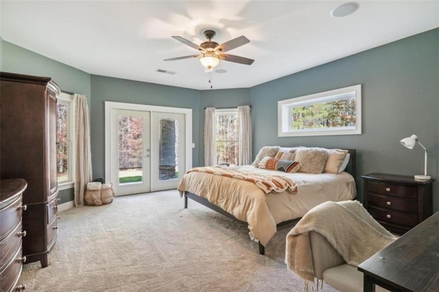 carpeted bedroom with access to outside, ceiling fan, and french doors