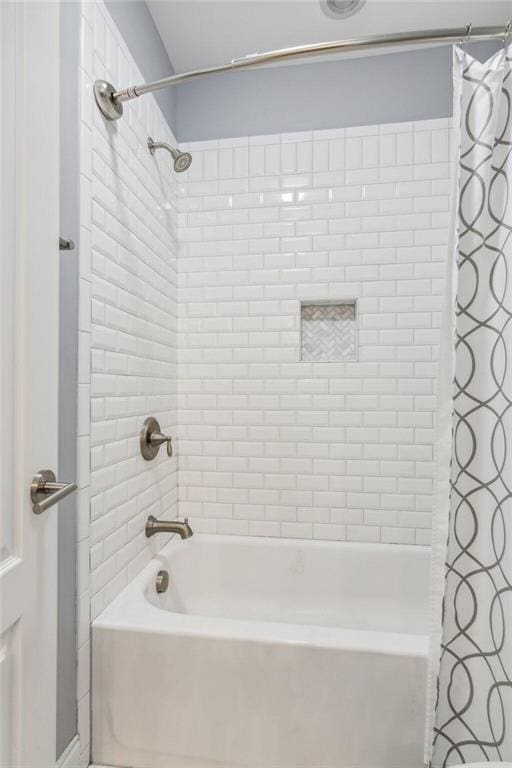 bathroom featuring shower / bath combo with shower curtain