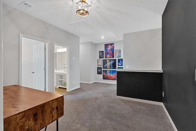 carpeted home office with attic access, baseboards, and visible vents