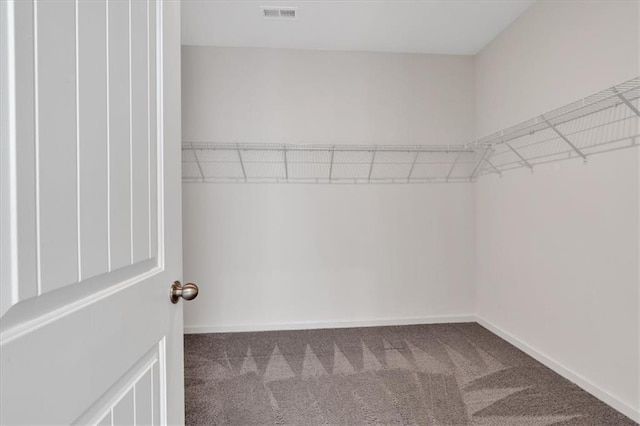 walk in closet with carpet flooring and visible vents