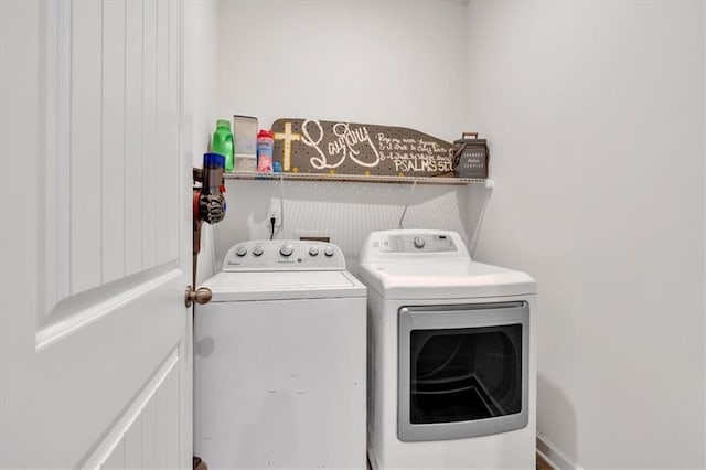 clothes washing area with laundry area and separate washer and dryer