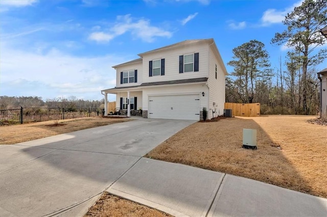 view of front of home featuring central air condition unit, an attached garage, fence, and driveway