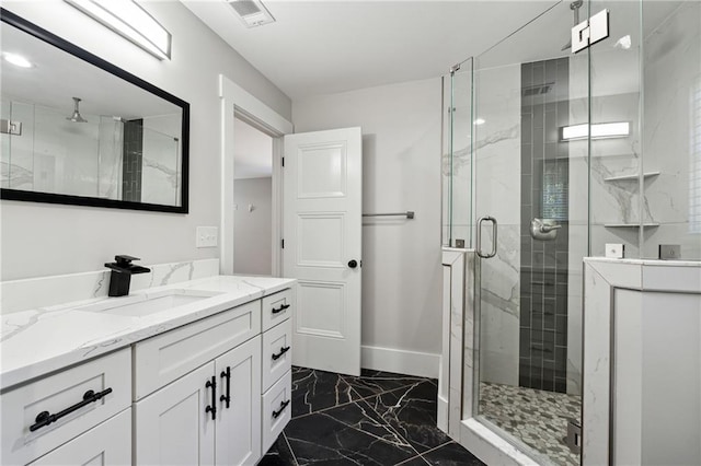 bathroom with an enclosed shower and vanity