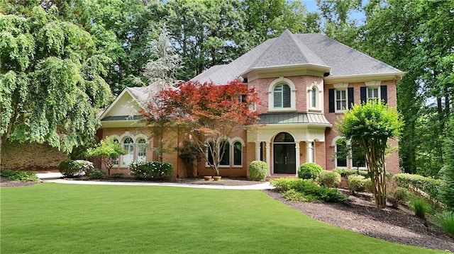 5040 Harrington Rd, Johns Creek, GA 30022 - view of front of home featuring a front yard, a standing seam roof, and roof with shingles
