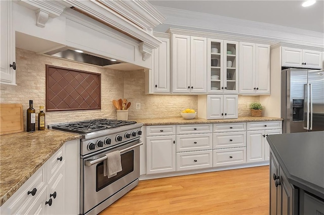 5040 Harrington Rd, Johns Creek, GA 30022 - kitchen with high quality appliances, tasteful backsplash, glass insert cabinets, white cabinets, and crown molding