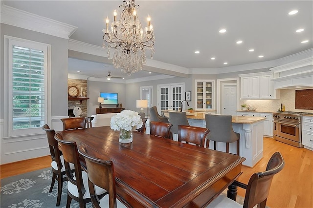 5040 Harrington Rd, Johns Creek, GA 30022 - dining room with light wood-type flooring, recessed lighting, crown molding, healthy amount of natural light, and a chandelier