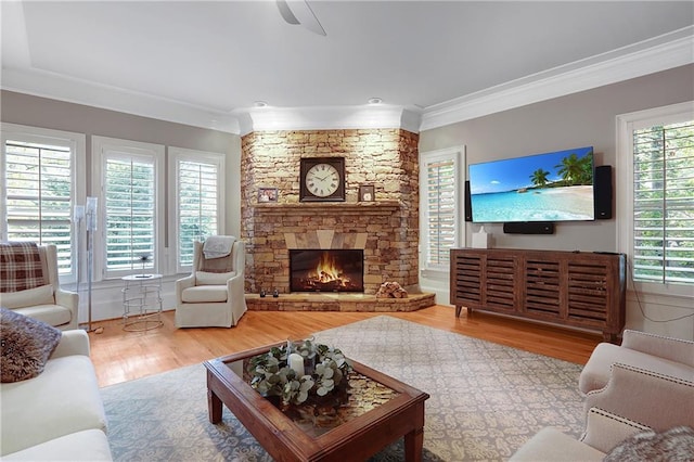 5040 Harrington Rd, Johns Creek, GA 30022 - living room featuring crown molding, wood finished floors, a fireplace, and a ceiling fan
