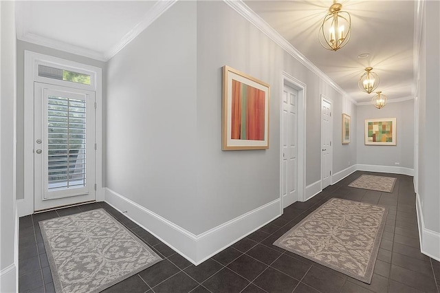 5040 Harrington Rd, Johns Creek, GA 30022 - foyer featuring a chandelier, ornamental molding, dark tile patterned floors, and baseboards