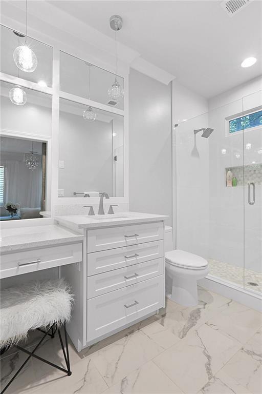 5040 Harrington Rd, Johns Creek, GA 30022 - bathroom with marble look tiles, a shower stall, toilet, vanity, and ensuite bathroom