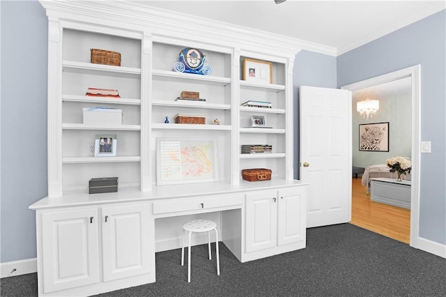 5040 Harrington Rd, Johns Creek, GA 30022 - home office featuring built in study area, ornamental molding, dark colored carpet, a chandelier, and baseboards