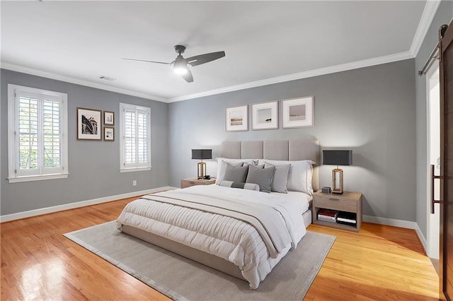 5040 Harrington Rd, Johns Creek, GA 30022 - bedroom featuring baseboards, light wood finished floors, ornamental molding, a barn door, and a ceiling fan