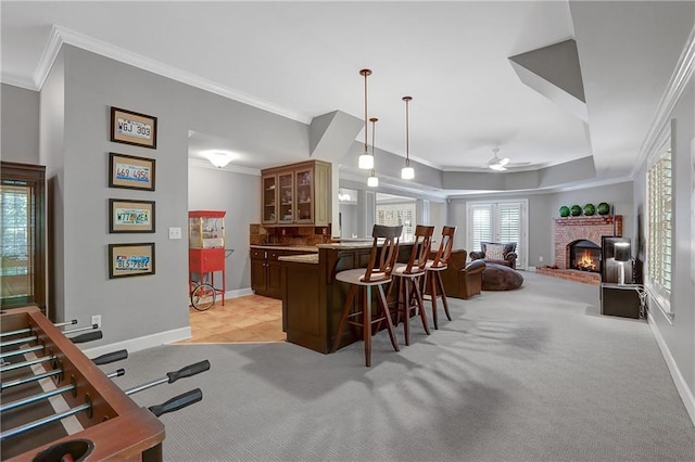 5040 Harrington Rd, Johns Creek, GA 30022 - indoor bar featuring ornamental molding, ceiling fan, light colored carpet, baseboards, and a brick fireplace