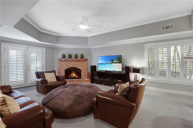 5040 Harrington Rd, Johns Creek, GA 30022 - carpeted living area with a ceiling fan, crown molding, plenty of natural light, a brick fireplace, and a tray ceiling