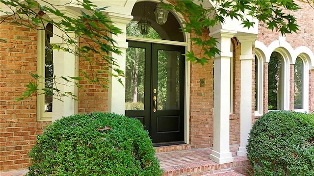 5040 Harrington Rd, Johns Creek, GA 30022 - view of exterior entry with french doors and brick siding