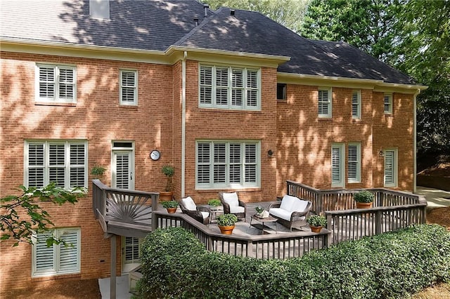 5040 Harrington Rd, Johns Creek, GA 30022 - rear view of house with brick siding, a deck, and outdoor lounge area