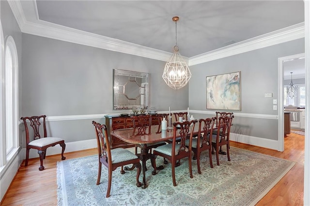 5040 Harrington Rd, Johns Creek, GA 30022 - dining space with a chandelier, light wood-style flooring, crown molding, and baseboards