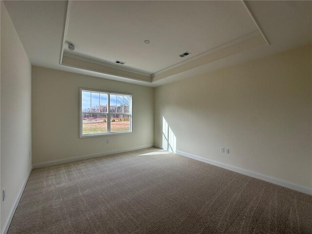 1802 Bonica Xing Unit 1802, Cumming, GA 30040 - spare room featuring baseboards, carpet flooring, a tray ceiling, and visible vents
